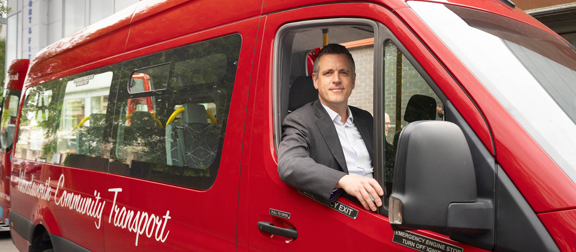 Wandsworth Council's Leader Simon Hogg is pictured in the driving seat of the Wandsworth community bus 