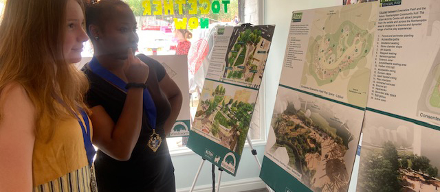 Youth Mayor Millie Quinn and Deputy Youth Mayor Favour Oniri are pictured studying exhibition boards which introduce the Alton Renewal plans.